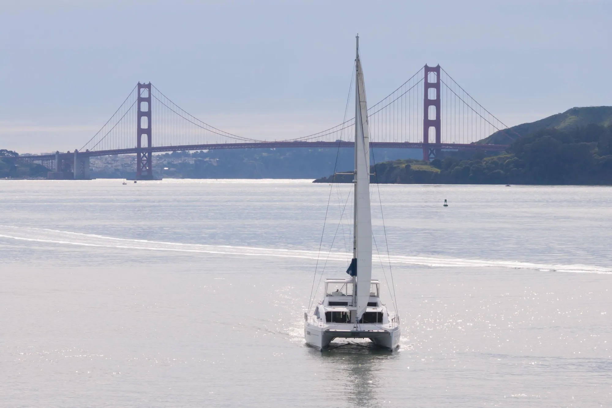 Sailboat Leopard 58 (2015) near Golden Gate Bridge on a sunny day.