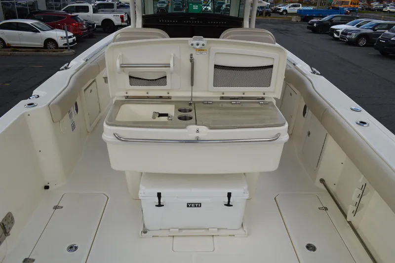  Yacht Photos Pics 2018 Boston Whaler 330 Outrage boat interior with storage and Yeti cooler.