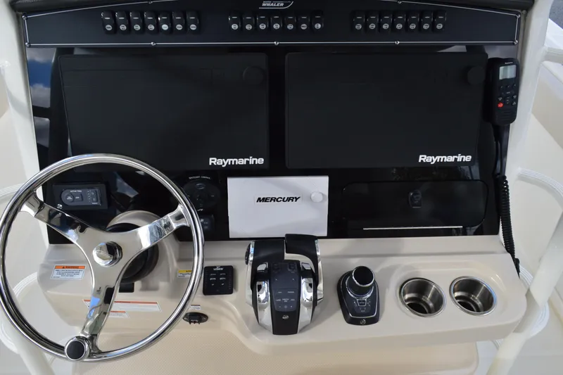  Yacht Photos Pics Control panel of 2018 Boston Whaler 330 Outrage with Raymarine electronics and Mercury controls.