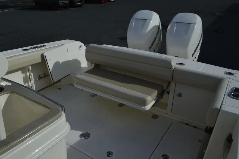  Yacht Photos Pics 2018 Boston Whaler 330 Outrage boat with dual engines and seating area.