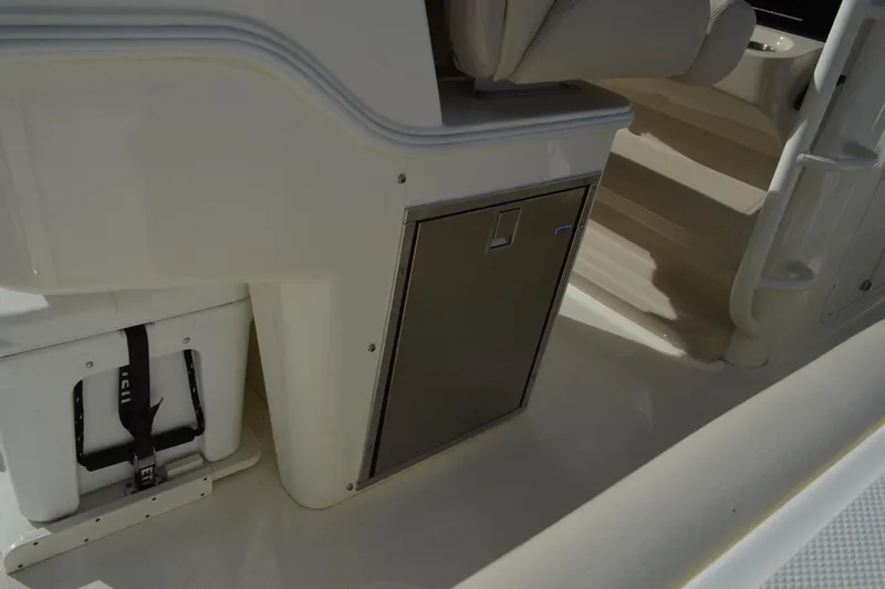  Yacht Photos Pics 2018 Boston Whaler 330 Outrage interior with storage compartment and seating.
