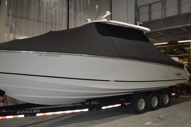  Yacht Photos Pics 2018 Boston Whaler 330 Outrage boat on trailer, covered, in indoor storage.