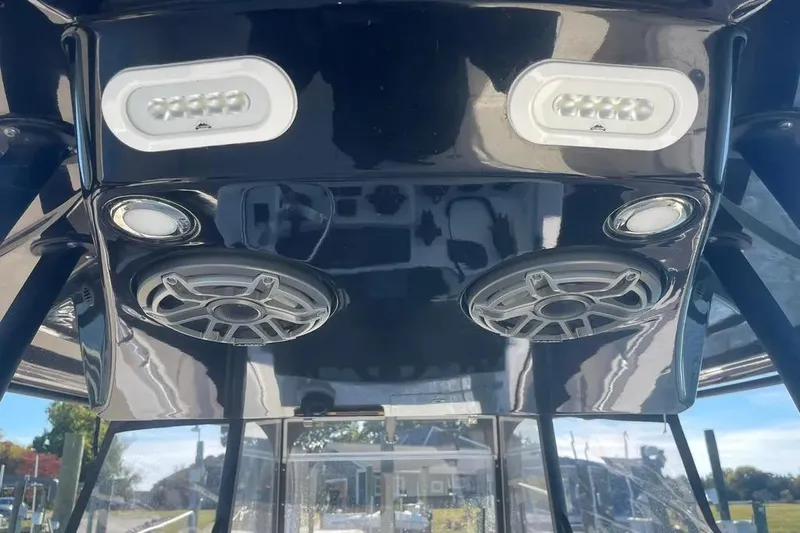  Yacht Photos Pics 2023 Cobia 320 Center Console boat speakers and lights on black panel.