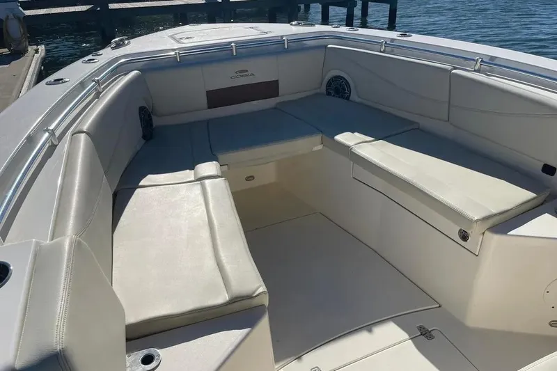  Yacht Photos Pics 2023 Cobia 320 Center Console boat with spacious seating area and sleek design.