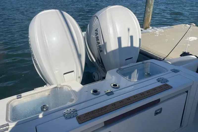 Yacht Photos Pics 2023 Cobia 320 Center Console with twin Yamaha outboard engines at dock.