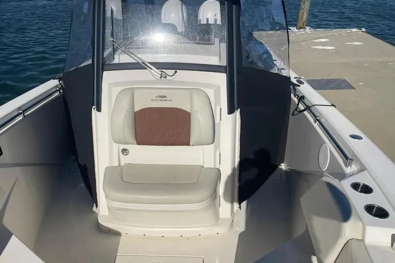  Yacht Photos Pics 2023 Cobia 320 Center Console boat interior with seating and console view.