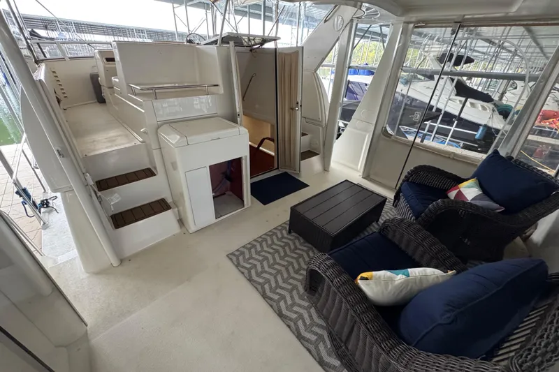  Yacht Photos Pics 2000 Carver 406 Aft Cabin Motor Yacht interior with seating area and stairs.