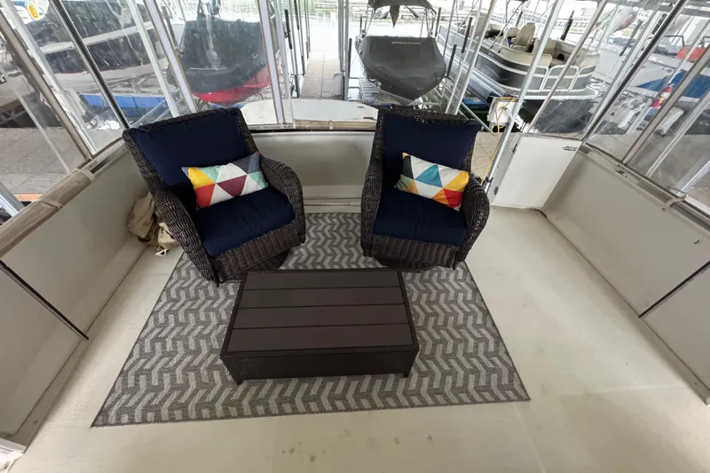  Yacht Photos Pics 2000 Carver 406 Aft Cabin Motor Yacht interior with cozy seating and colorful cushions.