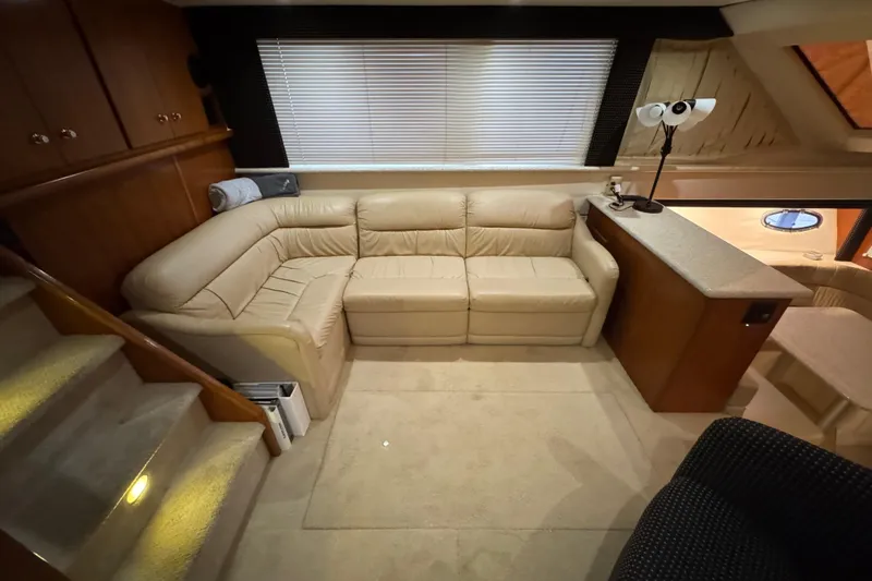  Yacht Photos Pics Interior of 2000 Carver 406 Aft Cabin Motor Yacht with beige leather seating and wooden cabinetry.