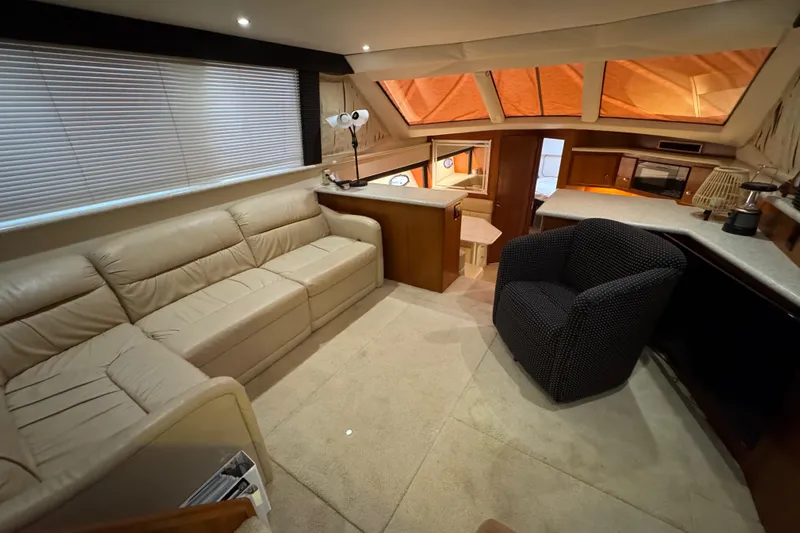  Yacht Photos Pics Luxurious interior of 2000 Carver 406 Aft Cabin Motor Yacht with plush seating and modern amenities.