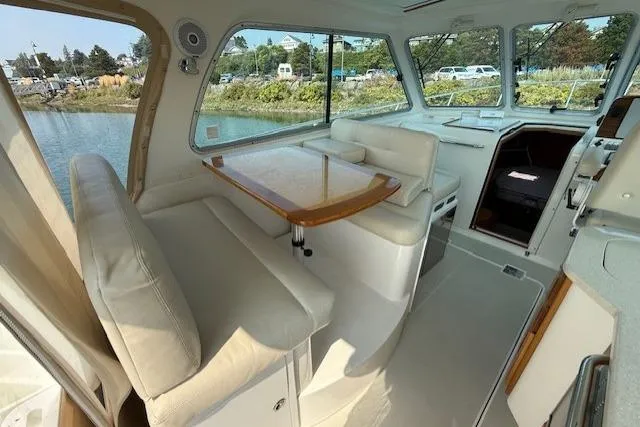 Naut On Call Yacht Photos Pics Interior of 2016 Back Cove 34 yacht with elegant seating and dining area.