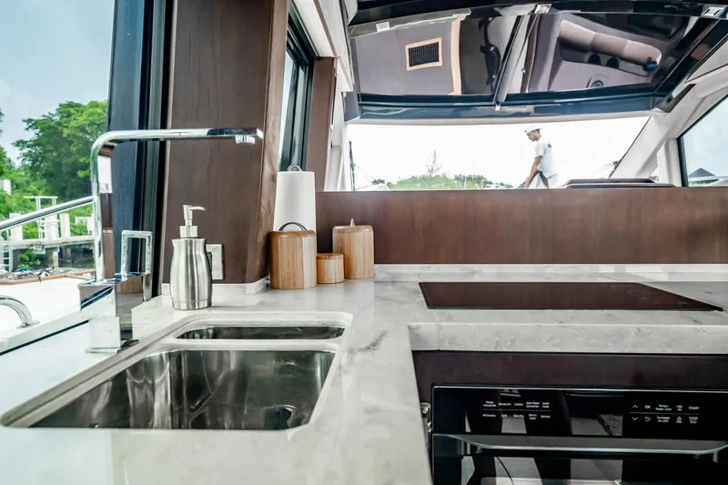 Bikini Blues Yacht Photos Pics Modern kitchen interior of 2017 Galeon 510 Sky yacht with sleek design and appliances.