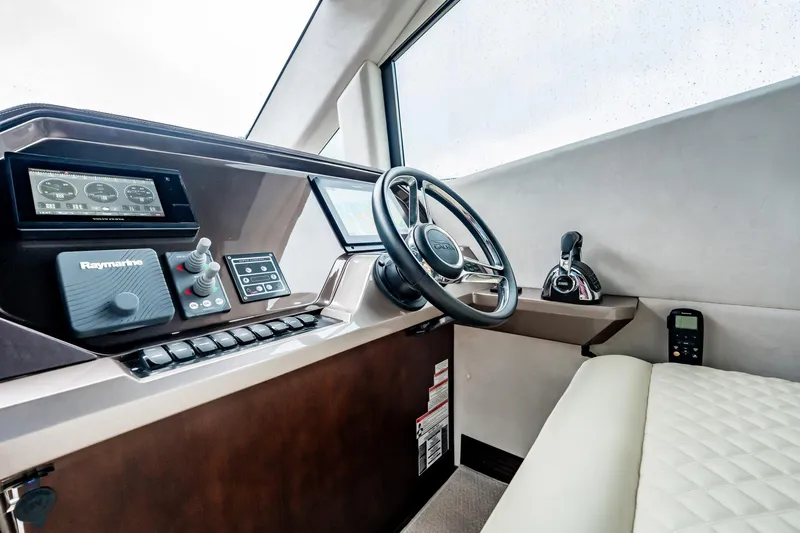 Bikini Blues Yacht Photos Pics Interior helm of 2017 Galeon 510 Sky yacht with modern controls and steering wheel.