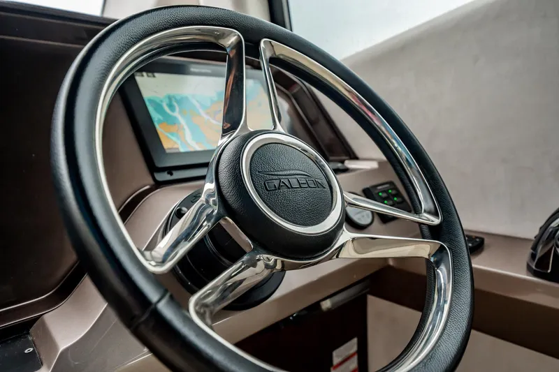 Bikini Blues Yacht Photos Pics Steering wheel of 2017 Galeon 510 Sky yacht with navigation display.