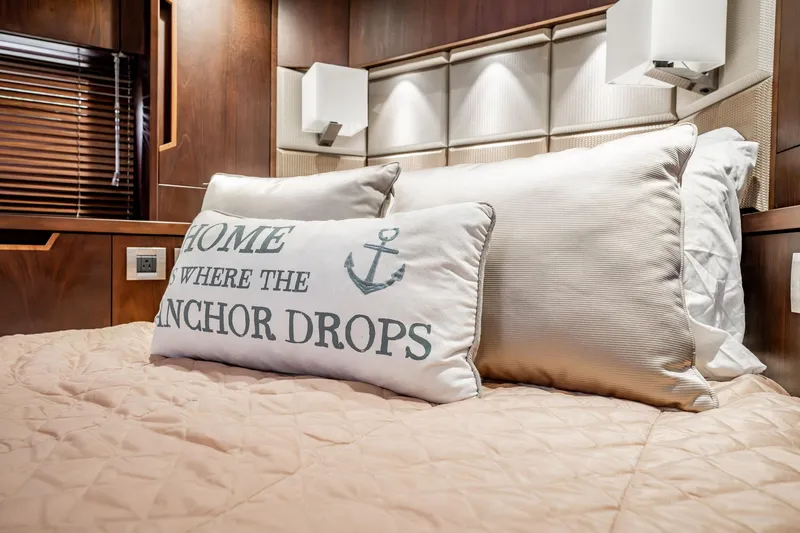 Bikini Blues Yacht Photos Pics Luxurious bedroom interior of 2017 Galeon 510 Sky yacht with nautical-themed pillow.