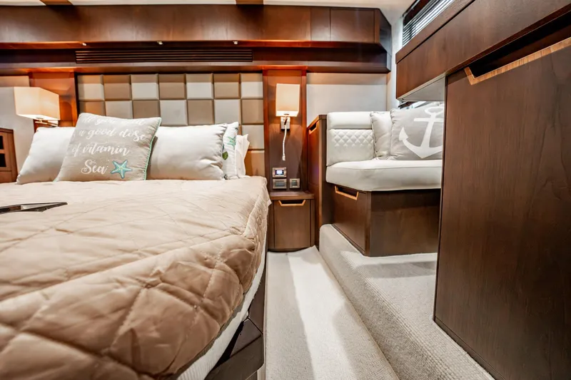 Bikini Blues Yacht Photos Pics Luxurious interior of 2017 Galeon 510 Sky yacht with cozy bedding and elegant wood finishes.