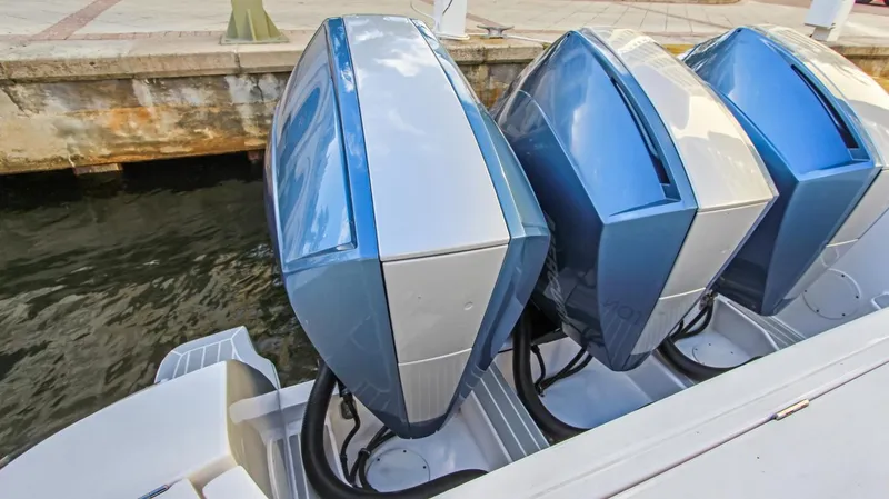 "alpha Bravo" Yacht Photos Pics 2022 Intrepid 375 Nomad SE with triple outboard engines docked at marina.