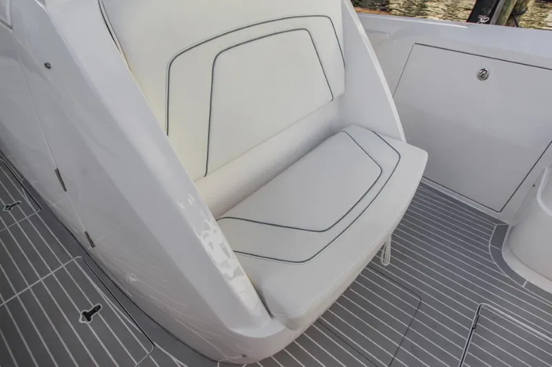 "alpha Bravo" Yacht Photos Pics 2022 Intrepid 375 Nomad SE boat seat with sleek white upholstery and modern design.