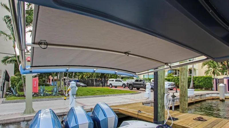 "alpha Bravo" Yacht Photos Pics 2022 Intrepid 375 Nomad SE boat with canopy, docked at marina.