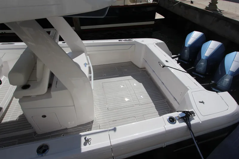 "alpha Bravo" Yacht Photos Pics 2022 Intrepid 375 Nomad SE boat deck with triple outboard engines.