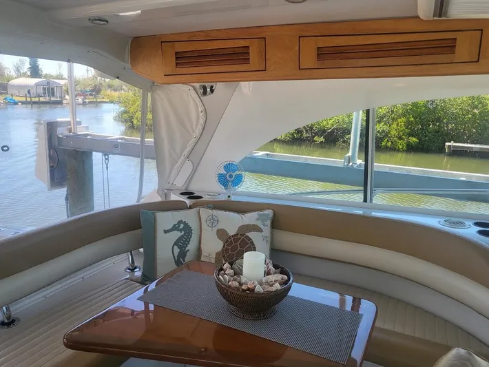  Yacht Photos Pics Interior of 2005 Glacier Bay 3480 Ocean Runner with cozy seating and decorative pillows.