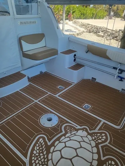  Yacht Photos Pics 2005 Glacier Bay 3480 Ocean Runner boat interior with turtle design flooring.