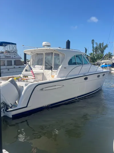  Yacht Photos Pics 2005 Glacier Bay 3480 Ocean Runner boat docked at marina under clear blue sky.
