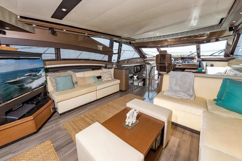 Docked Wages Yacht Photos Pics Luxurious interior of 2013 Marquis 63 Sport Yacht with modern furnishings and panoramic windows.