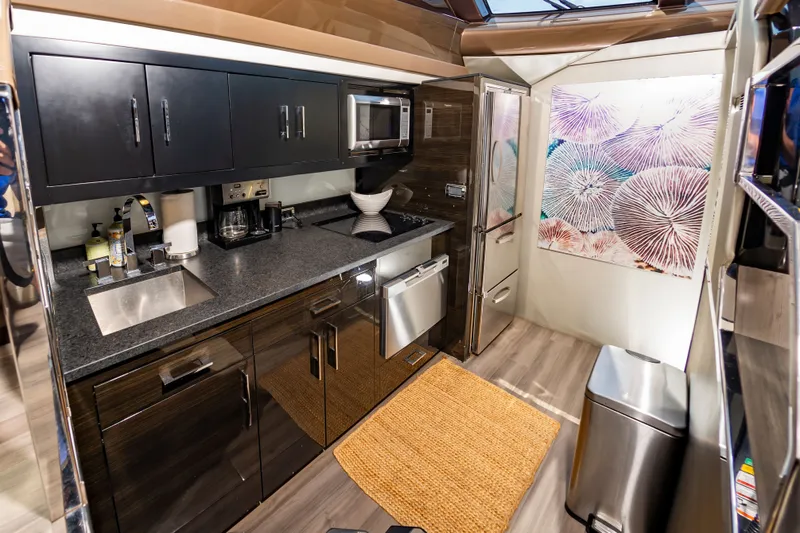 Docked Wages Yacht Photos Pics Luxurious kitchen interior of 2013 Marquis 63 Sport Yacht with modern appliances and stylish decor.