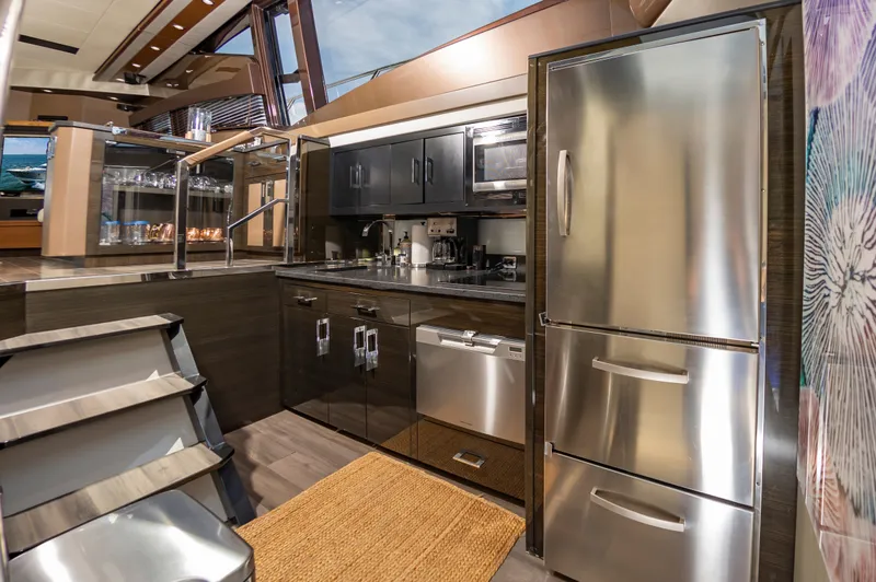 Docked Wages Yacht Photos Pics Luxurious kitchen interior of 2013 Marquis 63 Sport Yacht with modern appliances and sleek design.