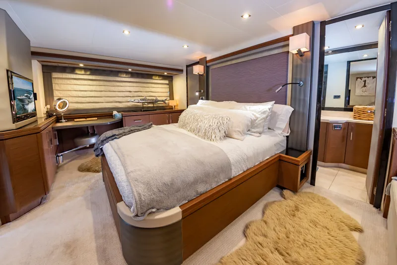Docked Wages Yacht Photos Pics Luxurious bedroom interior of 2013 Marquis 63 Sport Yacht with plush bedding and modern decor.