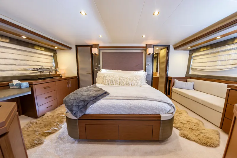 Docked Wages Yacht Photos Pics Luxurious bedroom interior of 2013 Marquis 63 Sport Yacht with elegant furnishings.