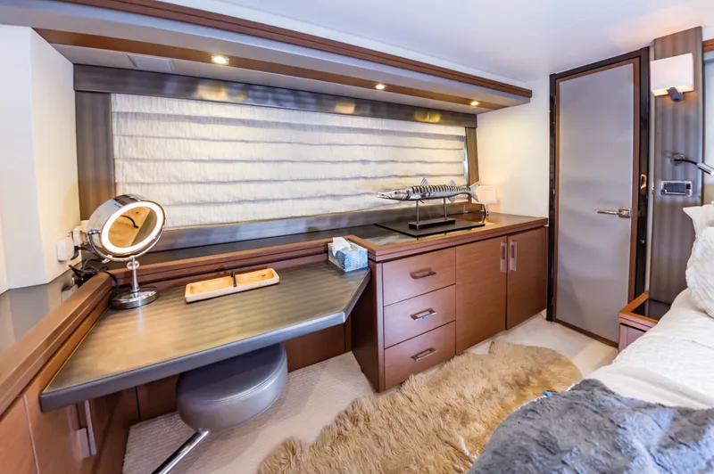 Docked Wages Yacht Photos Pics Luxurious interior of 2013 Marquis 63 Sport Yacht with modern desk and decor.