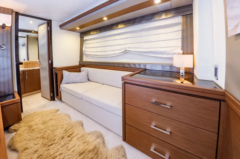 Docked Wages Yacht Photos Pics Luxurious interior of 2013 Marquis 63 Sport Yacht with cozy seating and elegant decor.