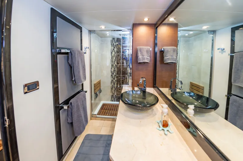 Docked Wages Yacht Photos Pics Luxurious bathroom in 2013 Marquis 63 Sport Yacht with modern fixtures and elegant design.