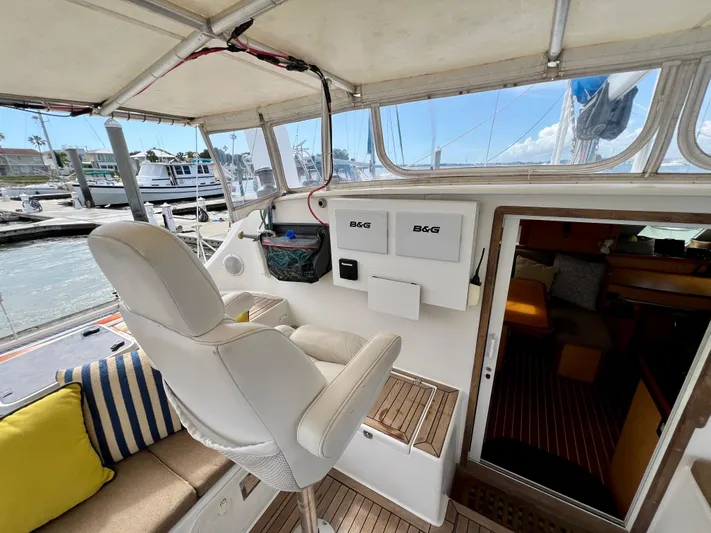 Trebuchet Yacht Photos Pics Interior of a 2000 Switch 51 yacht with helm station and seating area.