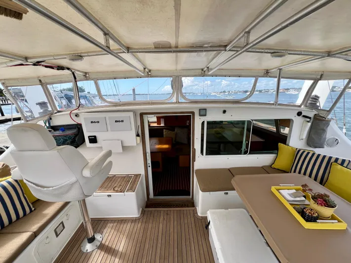 Trebuchet Yacht Photos Pics Interior of a 2000 Switch 51 yacht with seating and navigation area.