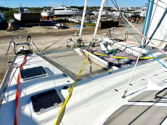 Trebuchet Yacht Photos Pics Sailboat deck with colorful ropes, docked in a marina, Switch 51 model, year 2000.