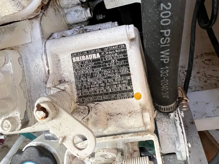 Trebuchet Yacht Photos Pics Close-up of machinery with a label and hose, Switch model 51, year 2000.