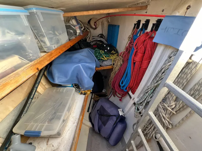 Trebuchet Yacht Photos Pics Storage area with ropes, containers, and equipment on a Switch 51 boat, year 2000.