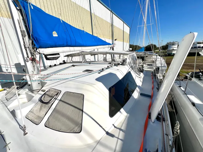 Trebuchet Yacht Photos Pics Sailboat Switch 51, 2000 model, docked with blue sail cover and clear sky.