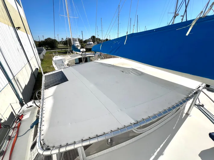 Trebuchet Yacht Photos Pics Sailboat deck with blue sail, Switch 51 model, year 2000, in marina setting.