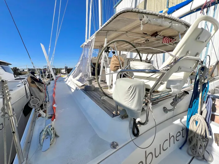 Trebuchet Yacht Photos Pics Sailboat Switch 51, year 2000, docked with clear blue sky background.
