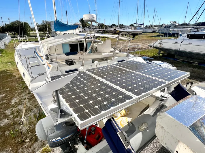 Trebuchet Yacht Photos Pics Switch 51 catamaran with solar panels, docked in a marina, year 2000 model.