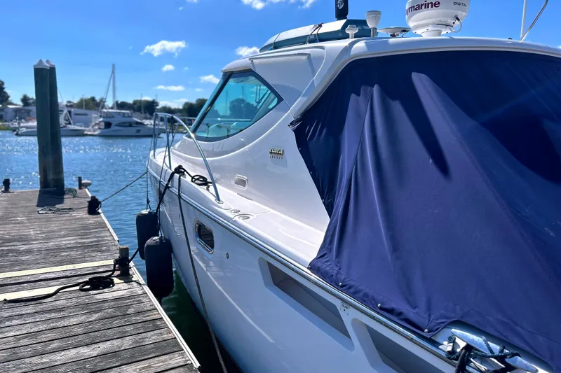  Yacht Photos Pics 2008 Tiara Yachts 3500 Sovran docked, featuring sleek design and blue cover.