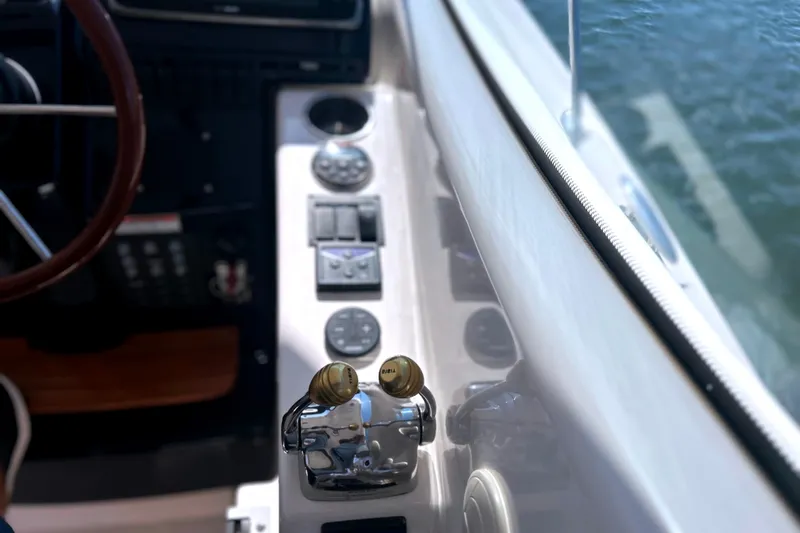  Yacht Photos Pics 2008 Tiara Yachts 3500 Sovran helm controls and dashboard, overlooking water.