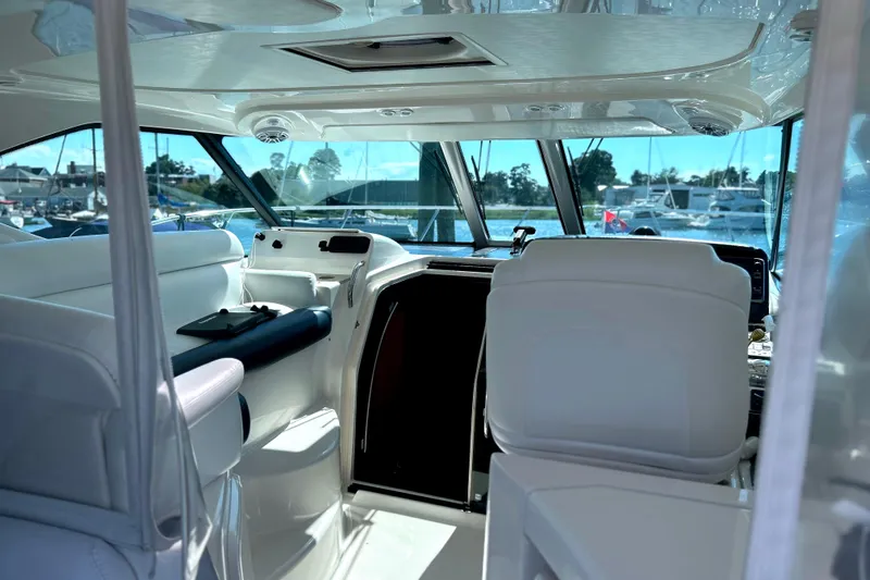  Yacht Photos Pics Interior view of 2008 Tiara Yachts 3500 Sovran, showcasing helm and seating area.