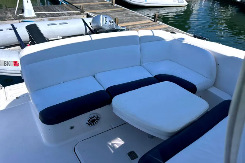  Yacht Photos Pics 2008 Tiara Yachts 3500 Sovran seating area with white and navy cushions at dock.