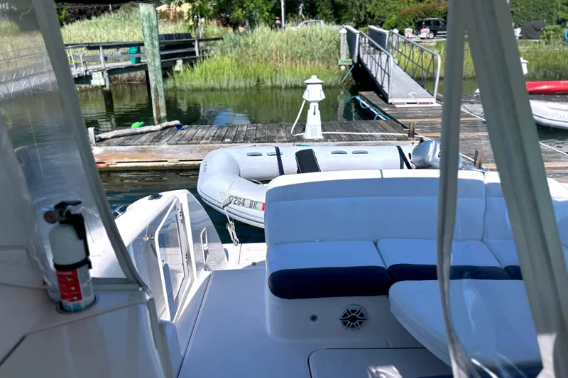  Yacht Photos Pics 2008 Tiara Yachts 3500 Sovran at dock with inflatable boat and scenic background.