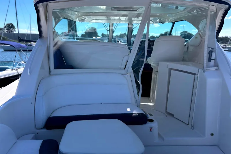  Yacht Photos Pics 2008 Tiara Yachts 3500 Sovran interior with white seating and helm, docked at marina.